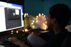 man in black shirt using computer